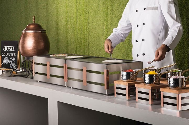 Live dosa counter at a Mintza catered event